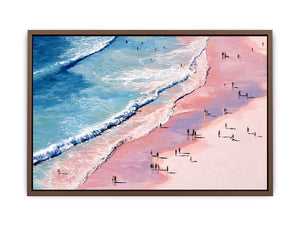 Pink shoreline wall art with turquoise waves and beach walkers for modern coastal living room