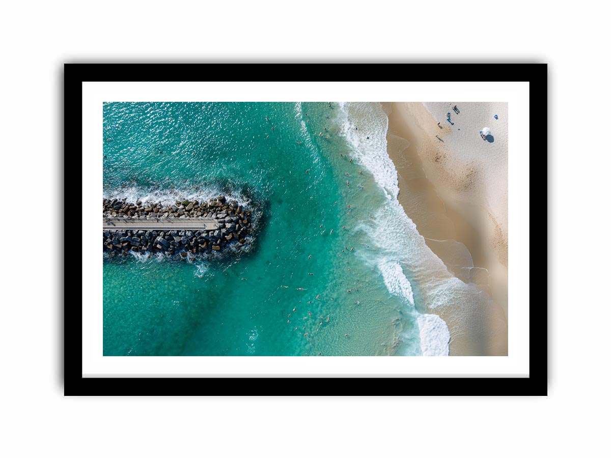 Turquoise beach drone print with swimmers and rock jetty for coastal living room decor