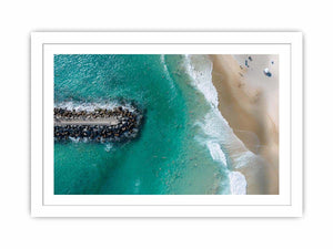 Turquoise beach drone print with swimmers and rock jetty for coastal living room decor