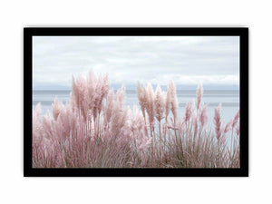 Soft blush pampas grass by the ocean as coastal botanical wall art for a serene bedroom.