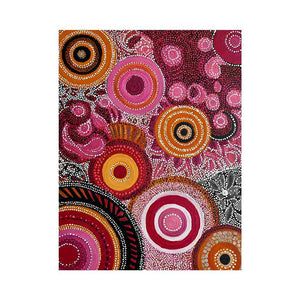 Ruby and ochre abstract dot canvas art with circular patterns for bold modern decor.