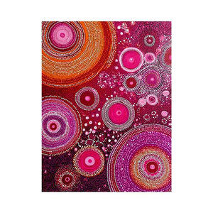 Magenta abstract dot canvas art with orange circular orbits for bold modern wall decor.