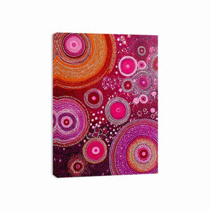 Magenta abstract dot canvas art with orange circular orbits for bold modern wall decor.