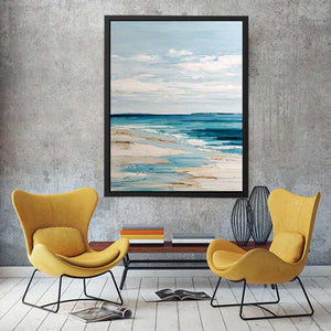 Minimal coastal canvas art with blue ocean and sandy beach tones for serene bedroom decor.