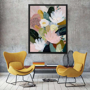 Soft abstract floral canvas art with blush flowers and green leaves for bedroom decor.