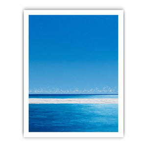 Bright turquoise ocean canvas art with white surf and blue sky for coastal bedroom decor.