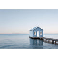 Blue boathouse over water artwork for coastal living room decor
