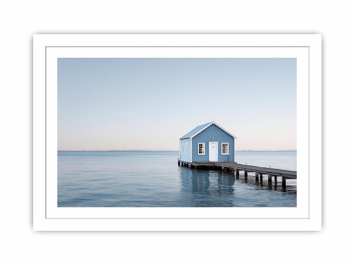 Blue boathouse over water artwork for coastal living room decor