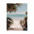 Beach pathway through dunes leading to a calm turquoise shoreline for coastal living room decor