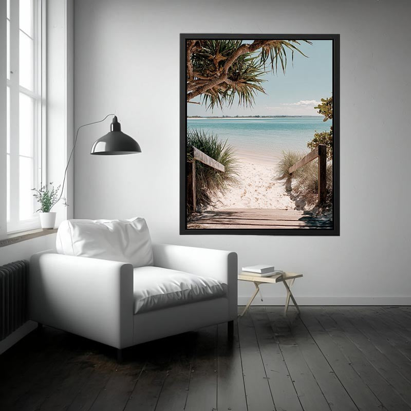 Beach pathway through dunes leading to a calm turquoise shoreline for coastal living room decor