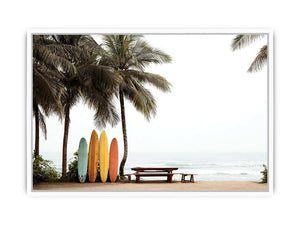 Colorful surfboards and palm trees overlooking the ocean for coastal wall decor