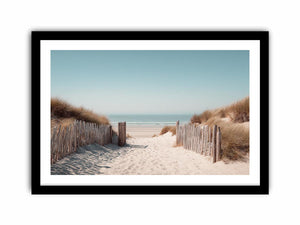 Sandy dune pathway leading to the ocean in minimalist coastal decor