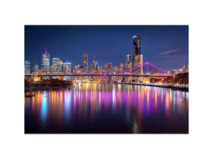 Illuminated bridge and city skyline canvas art for contemporary living room decor.