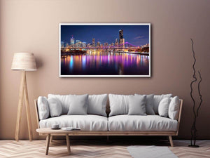Illuminated bridge and city skyline canvas art for contemporary living room decor.