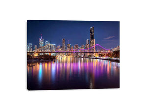 Illuminated bridge and city skyline canvas art for contemporary living room decor.
