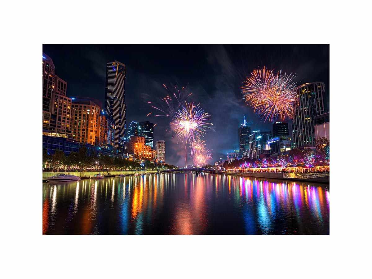 Fireworks over city skyline canvas art with river reflections for modern interiors.