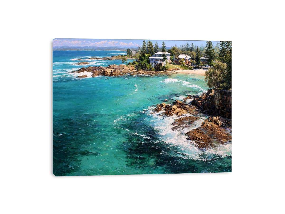 Turquoise coastal cove canvas art with rocky shoreline for modern living room decor.