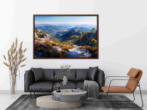 Expansive mountain valley landscape canvas art for wide modern living room wall.
