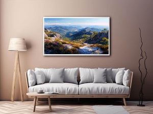 Expansive mountain valley landscape canvas art for wide modern living room wall.