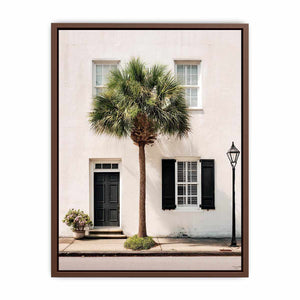 Elegant palm tree beside white coastal architecture for modern living room decor.