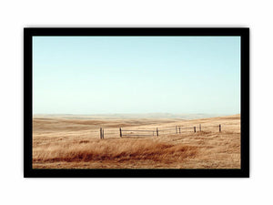 Prairie landscape photography with golden grass and fence for modern farmhouse decor