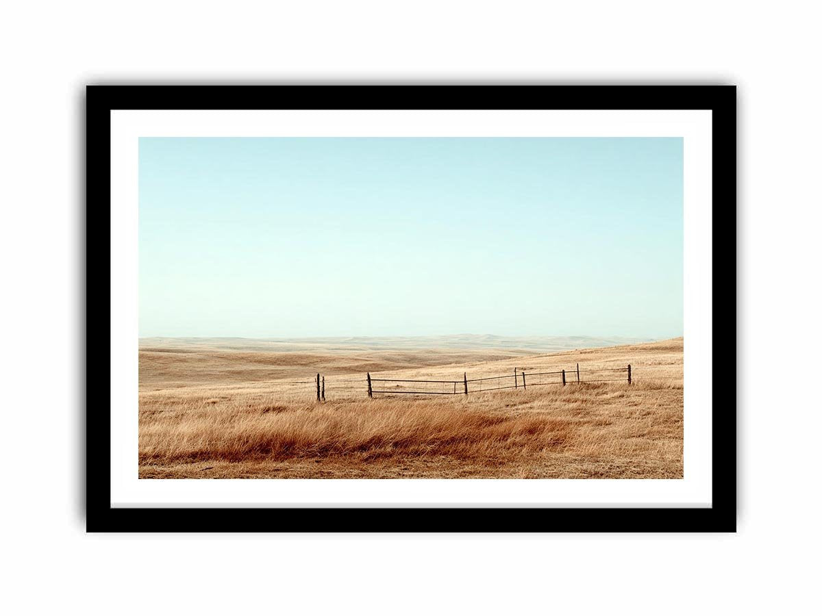 Prairie landscape photography with golden grass and fence for modern farmhouse decor