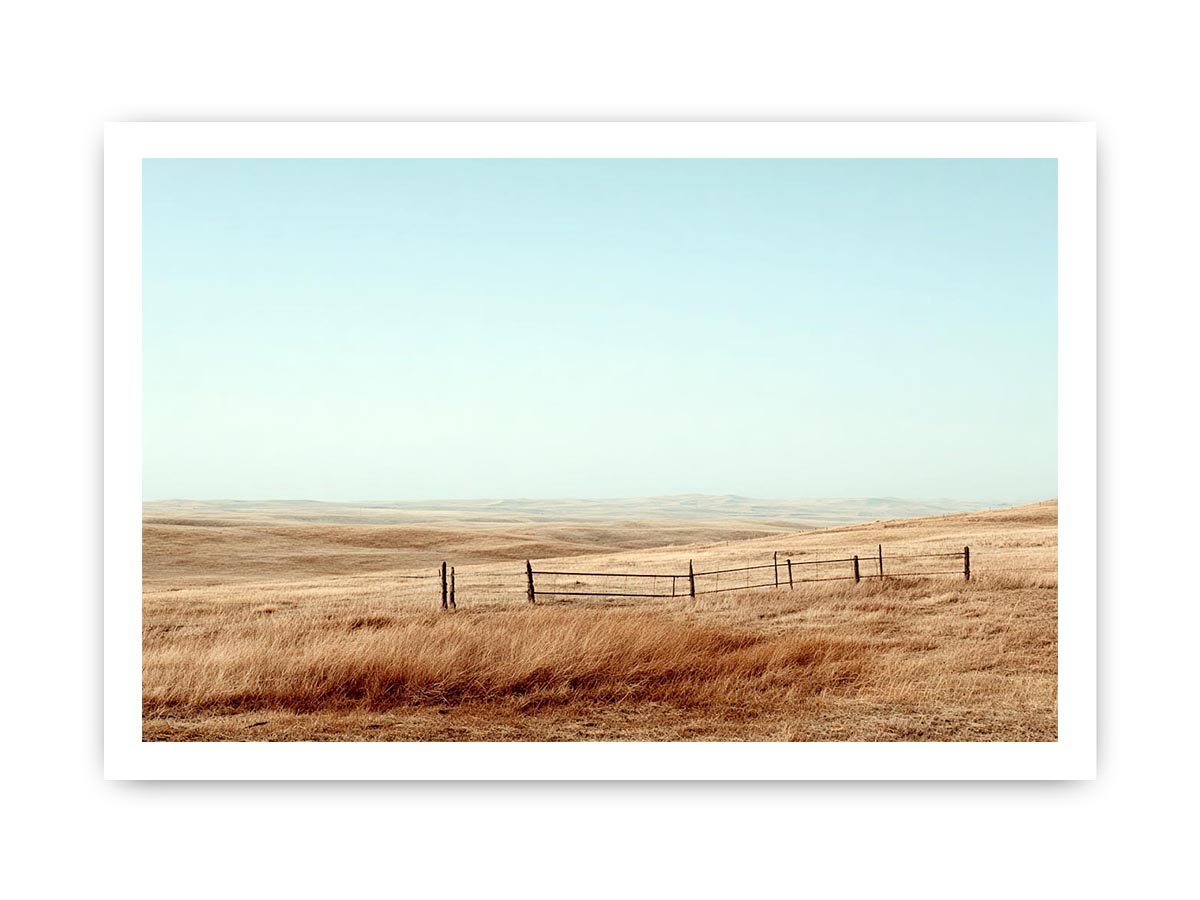 Prairie landscape photography with golden grass and fence for modern farmhouse decor