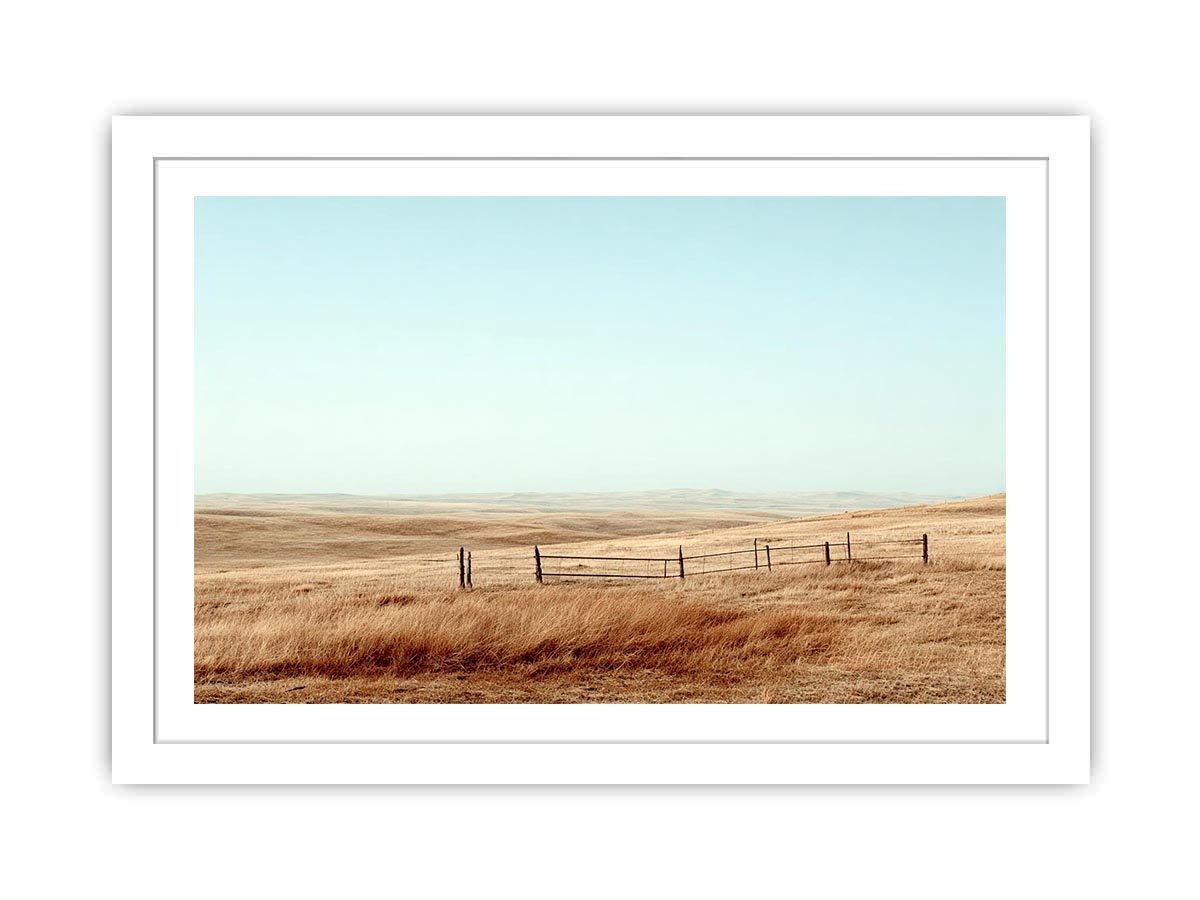 Prairie landscape photography with golden grass and fence for modern farmhouse decor