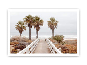 Coastal boardwalk and palm tree canvas art for serene beach house decor