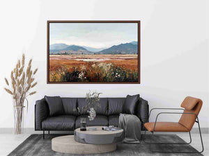 Impressionist mountain meadow painting with golden grasses, white wildflowers and distant blue mountains for living room decor.