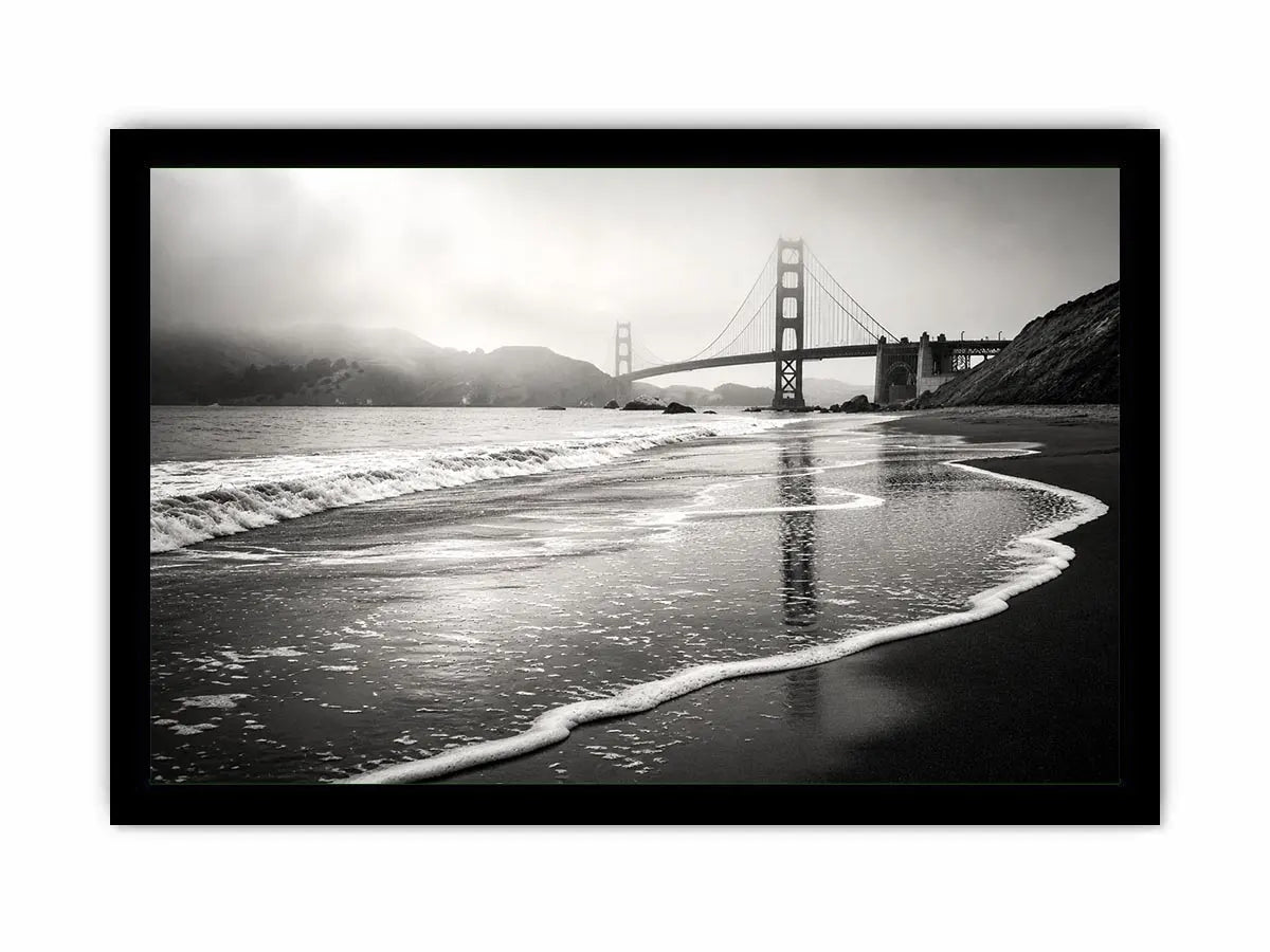 Minimal black and white coastal bridge wall art with misty beach waves and cinematic ocean landscape photography