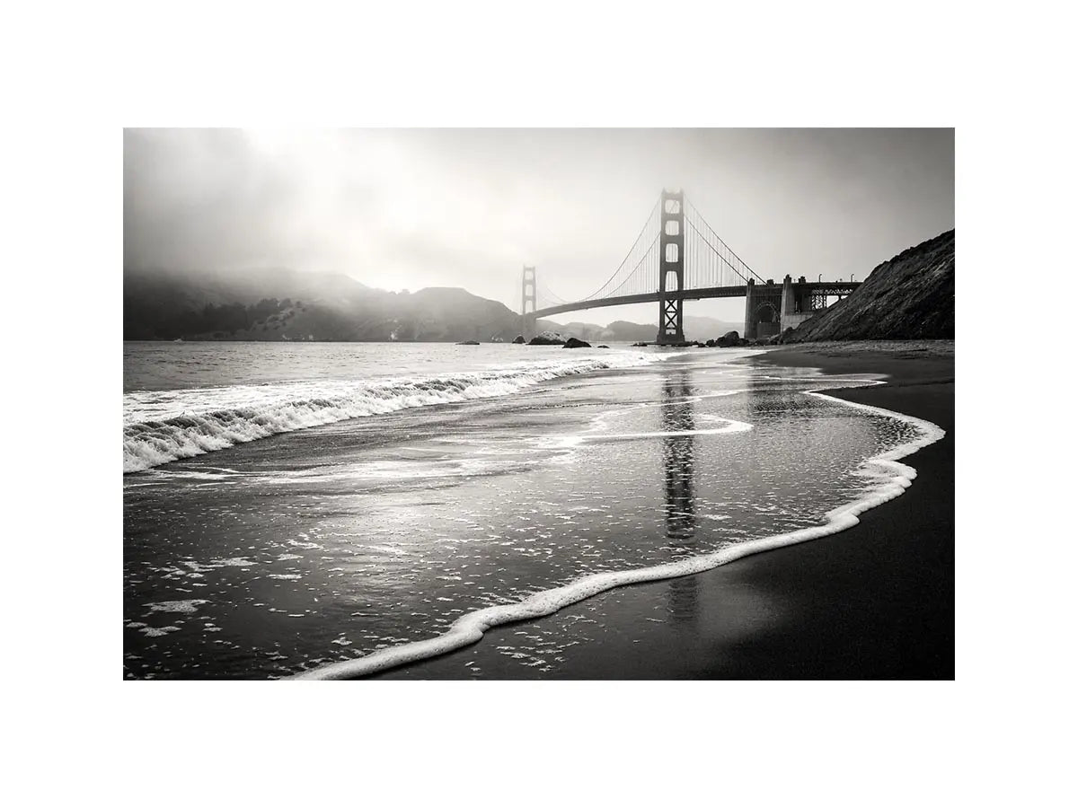Minimal black and white coastal bridge wall art with misty beach waves and cinematic ocean landscape photography