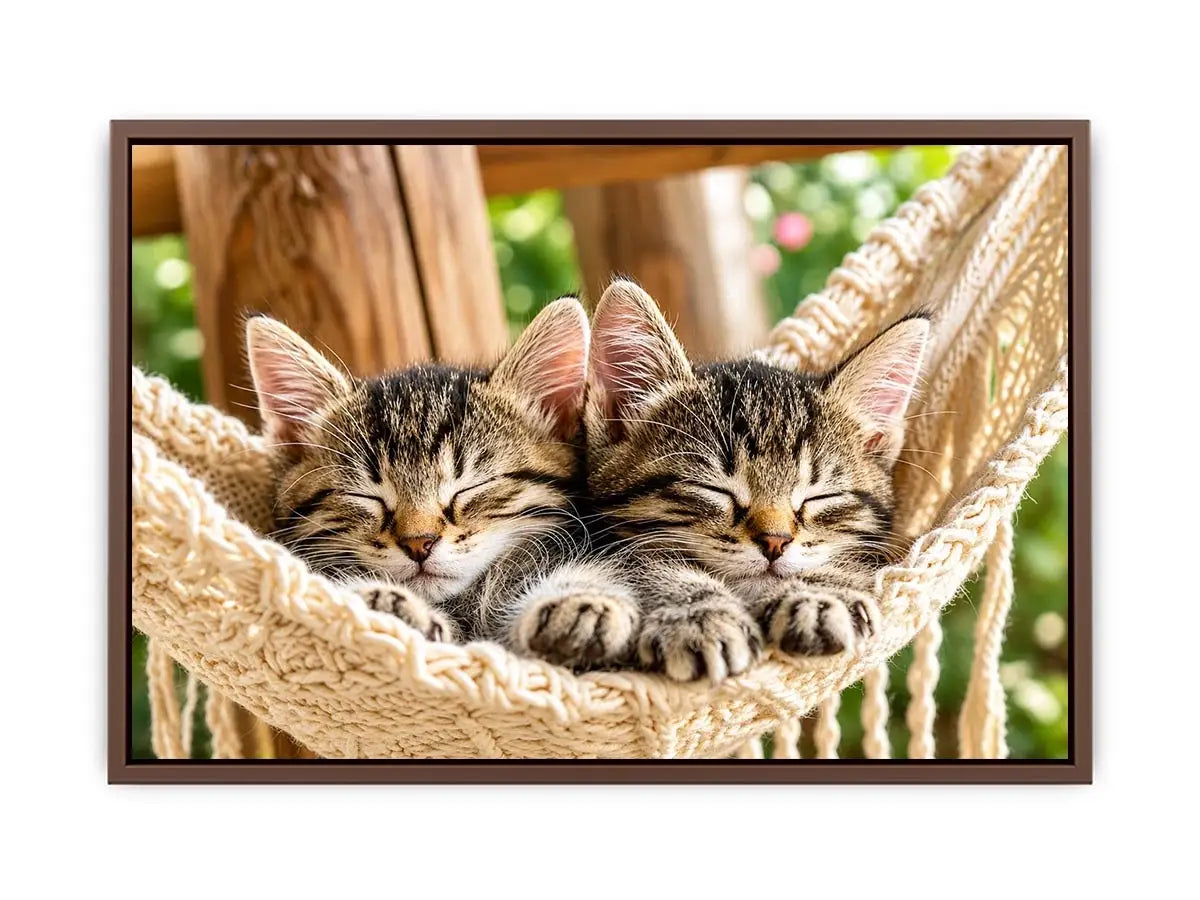 Bright cozy sleeping kitten wall art featuring two tabby cats resting in a woven hammock with soft natural daylight and neutral organic tones.