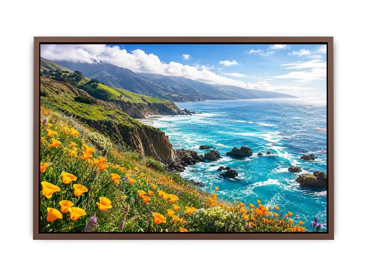 Bright coastal cliff landscape wall art featuring turquoise ocean waves, dramatic rocky coastline, and vibrant wildflowers under soft natural daylight.