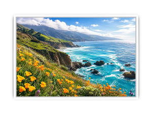 Bright coastal cliff landscape wall art featuring turquoise ocean waves, dramatic rocky coastline, and vibrant wildflowers under soft natural daylight.