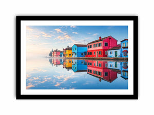 Bright colorful coastal village wall art featuring vibrant European houses reflected in calm water with soft fog and minimalist atmospheric tones.