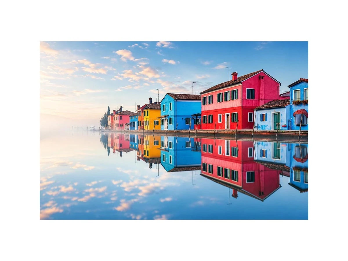 Bright colorful coastal village wall art featuring vibrant European houses reflected in calm water with soft fog and minimalist atmospheric tones.