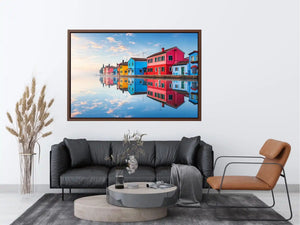 Bright colorful coastal village wall art featuring vibrant European houses reflected in calm water with soft fog and minimalist atmospheric tones.