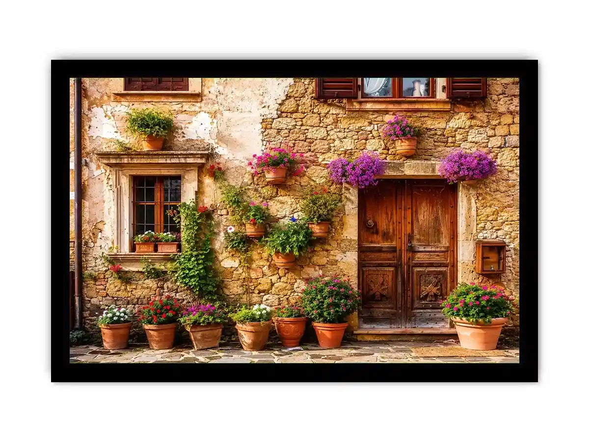 Rustic Mediterranean stone house facade with pink flowers and vintage wooden doors wall art canvas for luxury living room decor
