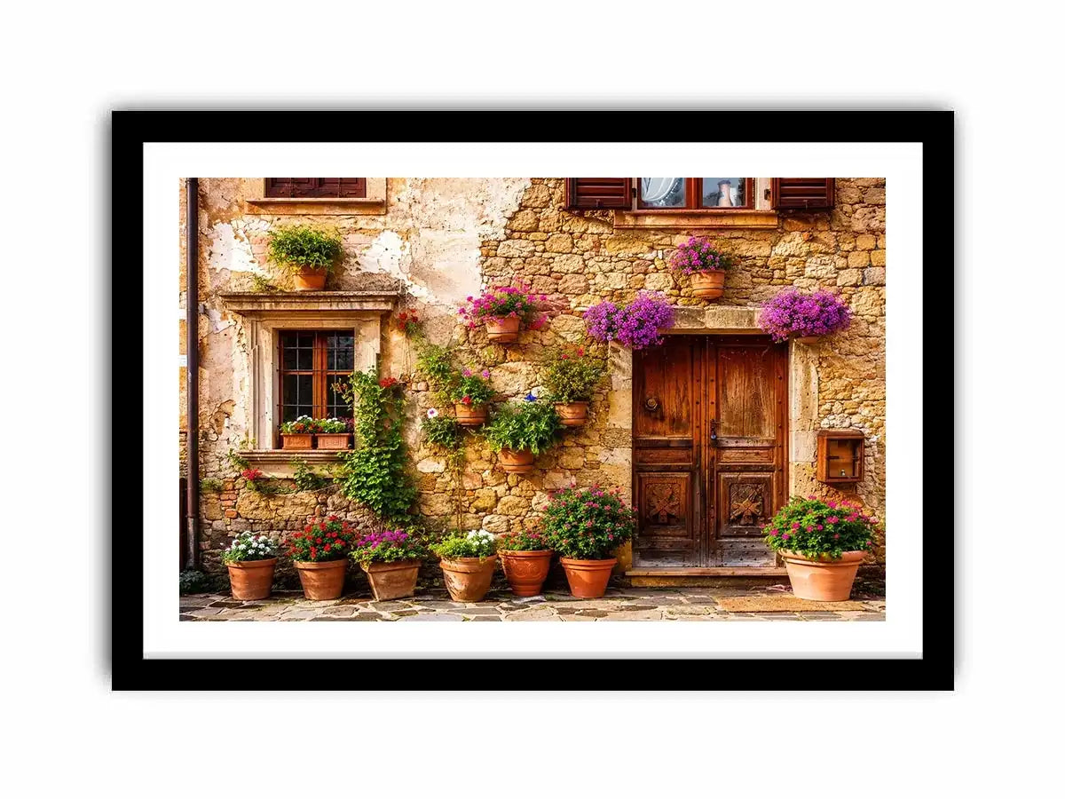 Rustic Mediterranean stone house facade with pink flowers and vintage wooden doors wall art canvas for luxury living room decor