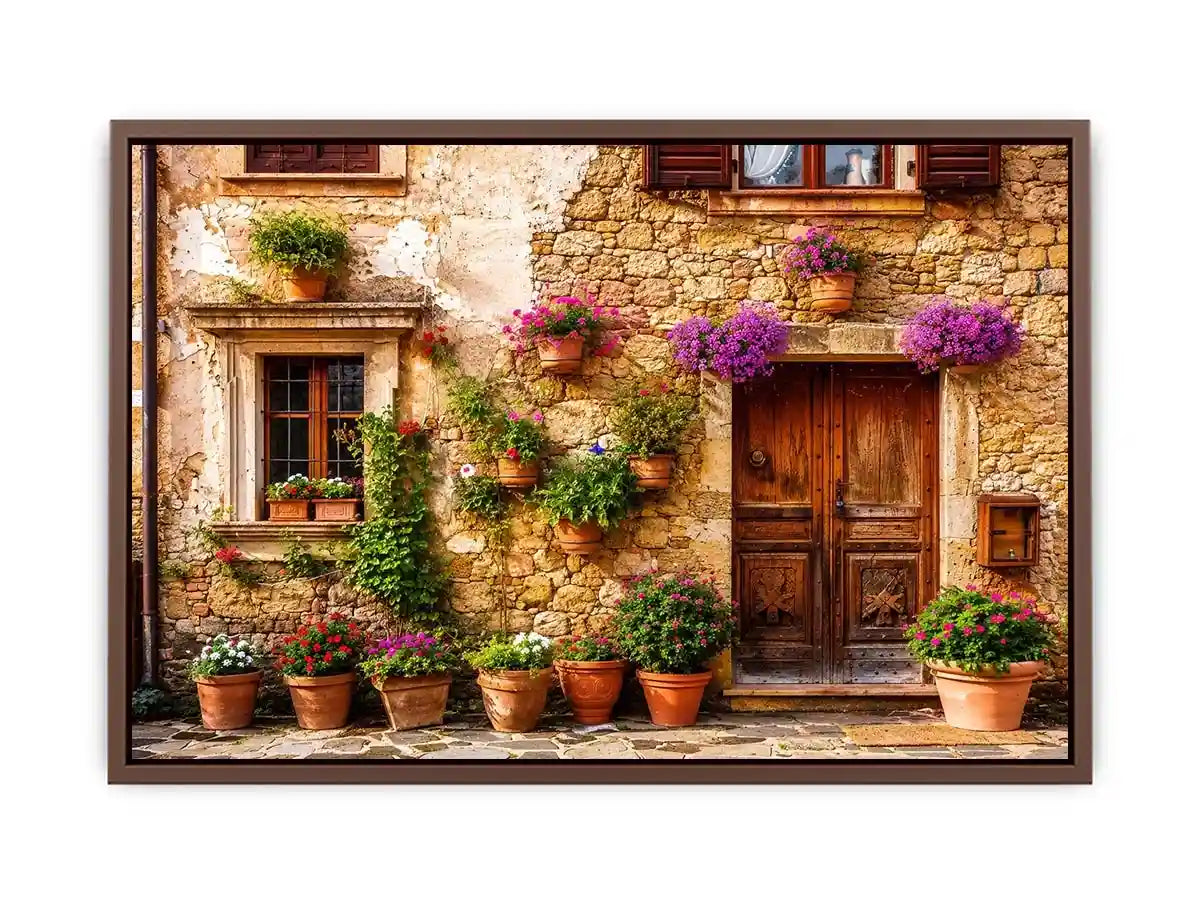 Rustic Mediterranean stone house facade with pink flowers and vintage wooden doors wall art canvas for luxury living room decor