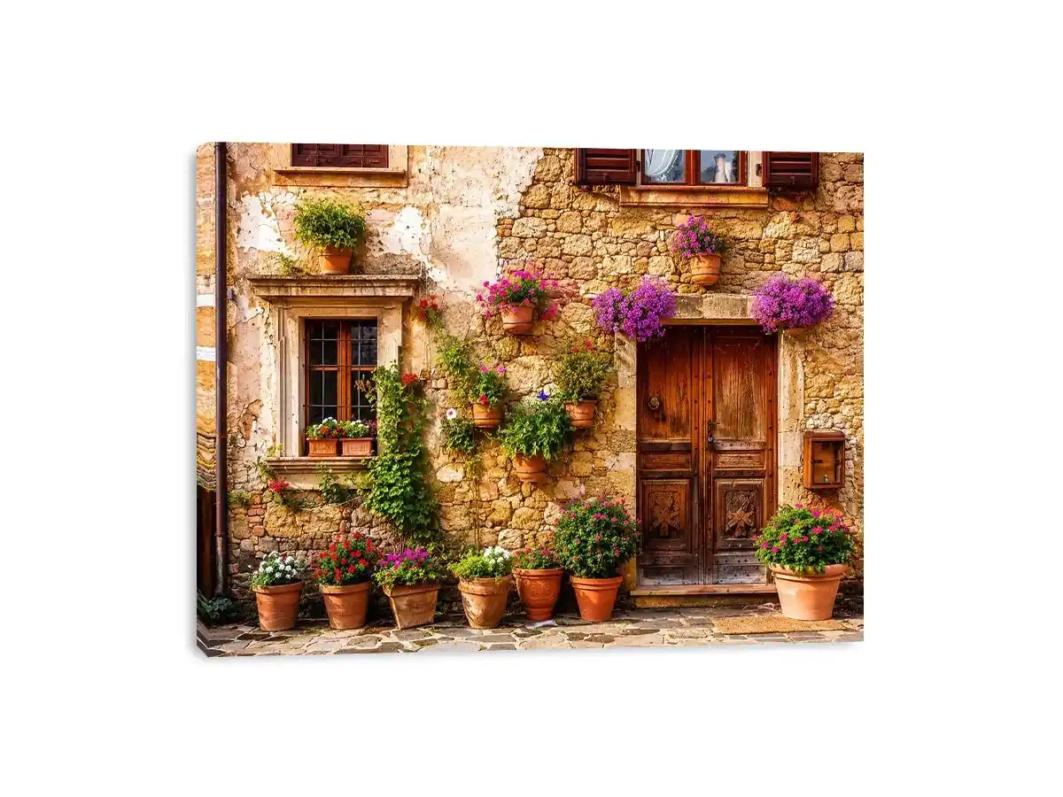 Rustic Mediterranean stone house facade with pink flowers and vintage wooden doors wall art canvas for luxury living room decor