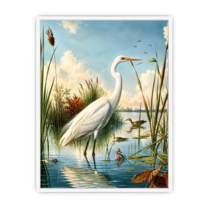 Vintage white heron standing in tranquil marshland with soft blue sky and reeds coastal bird wall art canvas
