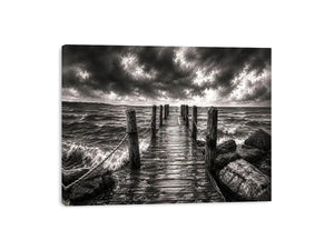 Black and white ocean pier wall art with dramatic coastal waves and minimalist nautical landscape aesthetic