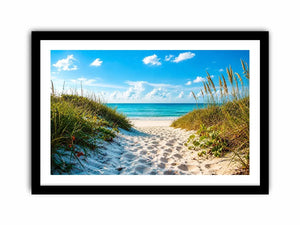 Coastal beach path wall art with sandy dunes leading to blue ocean under clear sky, serene seaside canvas for living room and beach house decor