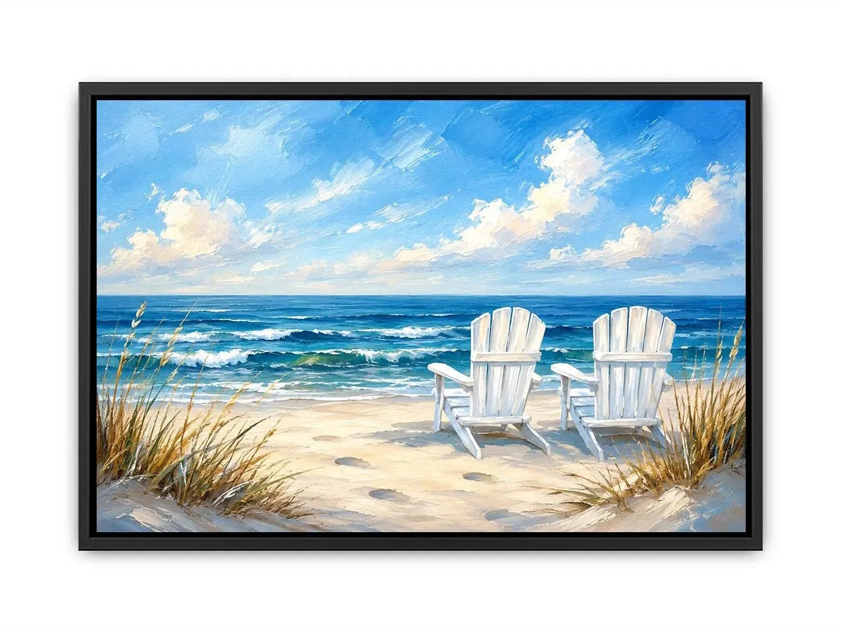 White beach chairs overlooking calm ocean waves on a sandy coastal shoreline