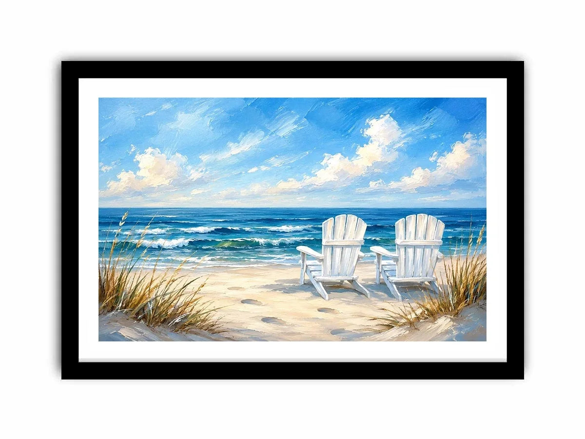 White beach chairs overlooking calm ocean waves on a sandy coastal shoreline