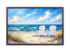 White beach chairs overlooking calm ocean waves on a sandy coastal shoreline