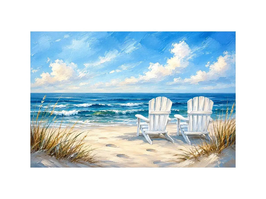 White beach chairs overlooking calm ocean waves on a sandy coastal shoreline