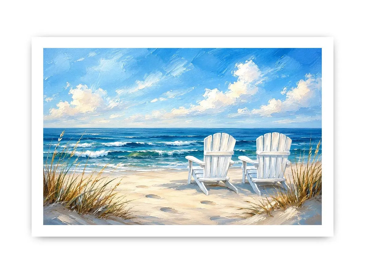 White beach chairs overlooking calm ocean waves on a sandy coastal shoreline